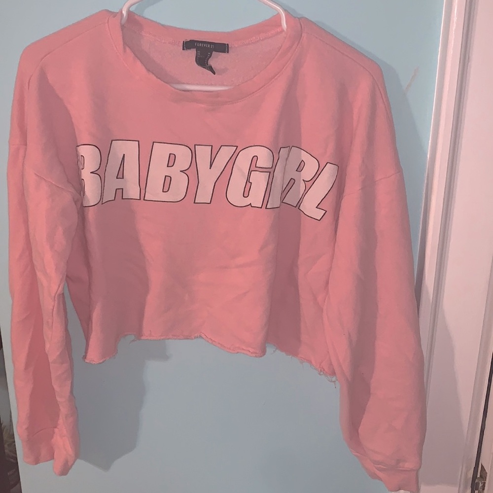 A cute light pink “babygirl” crop top